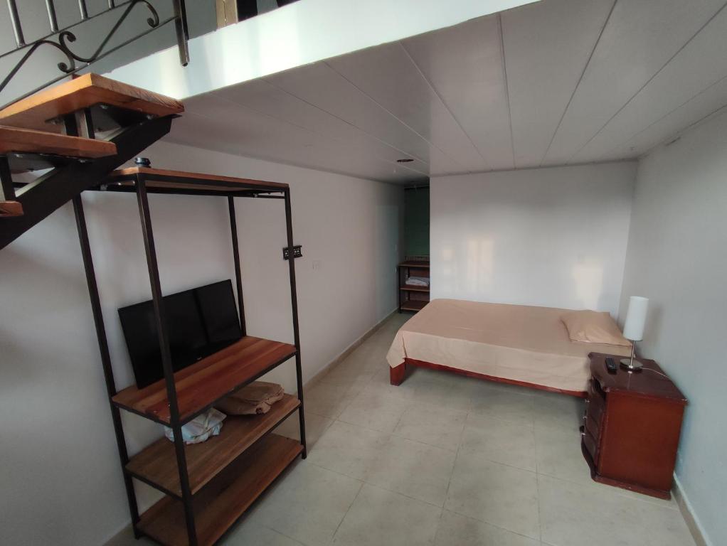 a bedroom with a bunk bed and a television at Casa Buenavista in Buenavista