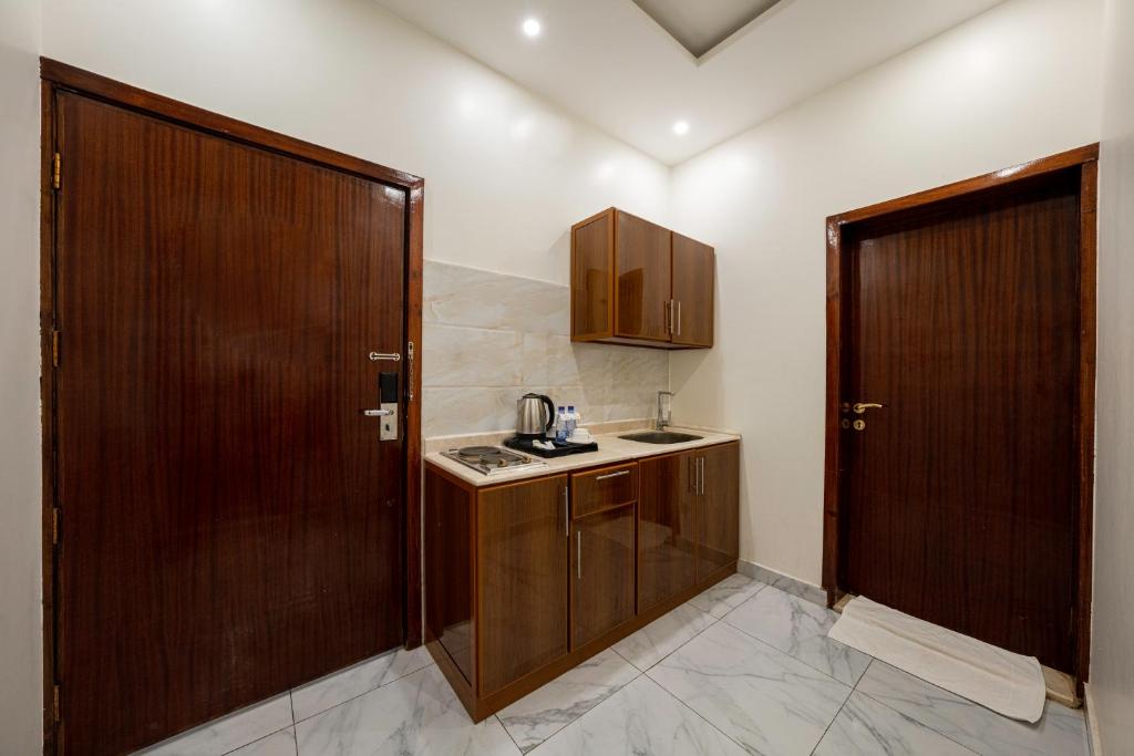 Kuchyň nebo kuchyňský kout v ubytování Masharef Abha Suites