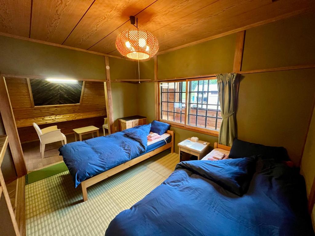 Postel nebo postele na pokoji v ubytování Little Alaskan Guest House