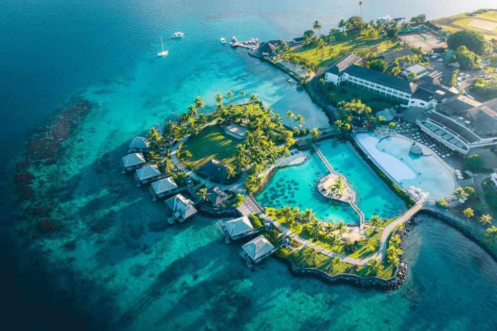 an aerial view of an island in the ocean at InterContinental Tahiti Resort & Spa, an IHG Hotel in Faaa
