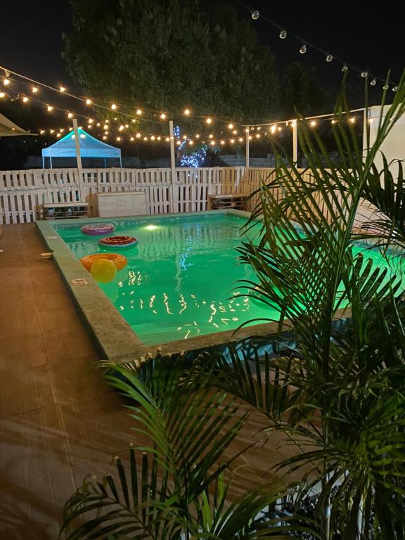 a swimming pool at night with lights around it at Suncress Bed and Breakfast in Kingston