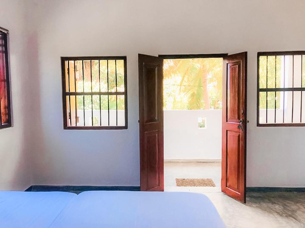Postel nebo postele na pokoji v ubytování Summer lodge-Tangalle