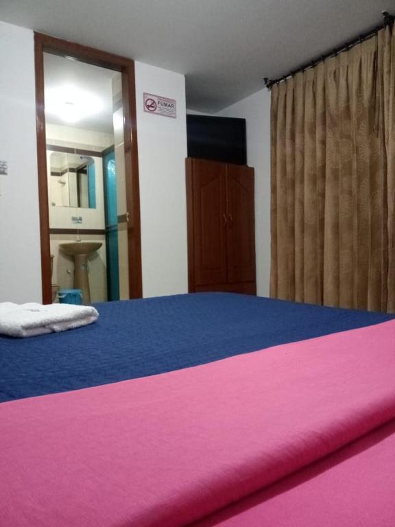 Postel nebo postele na pokoji v ubytování Hotel Manhattan City