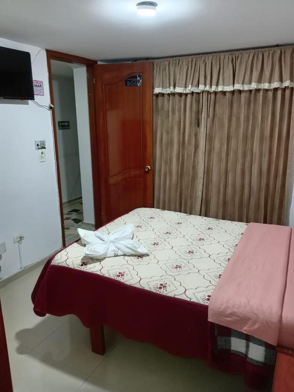 Postel nebo postele na pokoji v ubytování Hotel Manhattan City