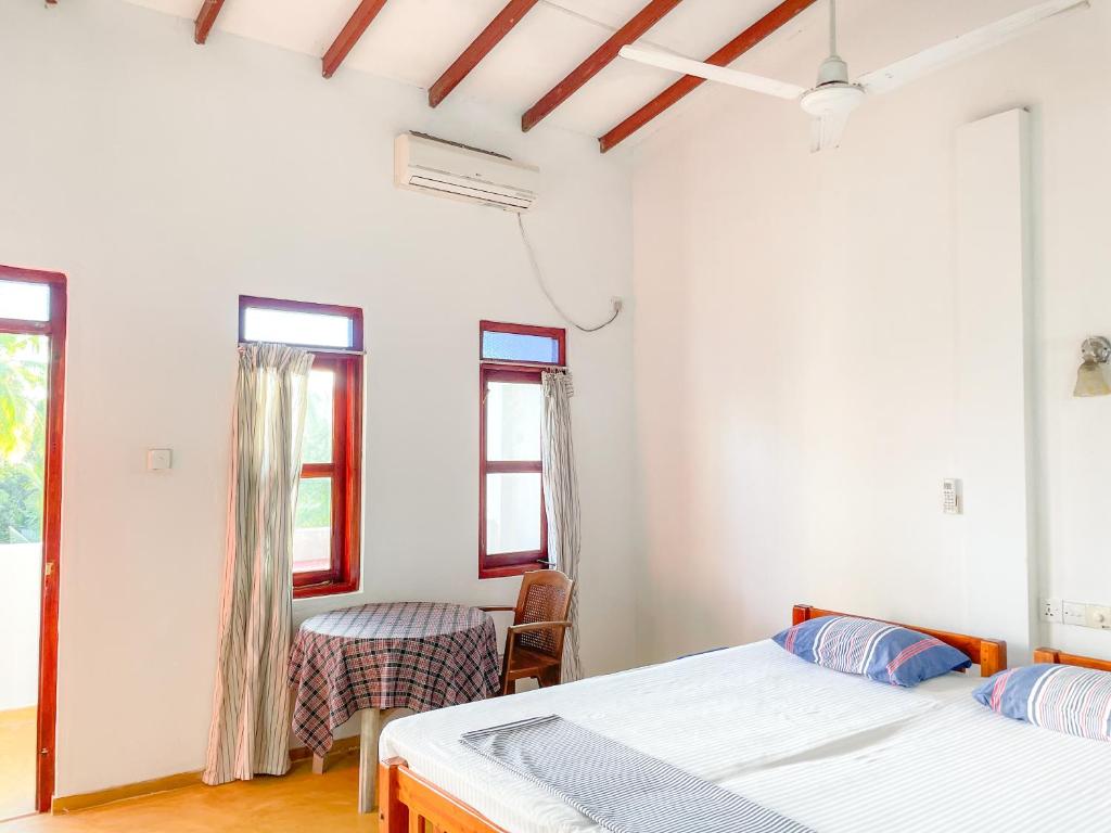 Postel nebo postele na pokoji v ubytování Summer lodge-Tangalle