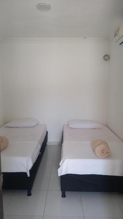 Letto o letti in una camera di Guajira Sunset Hostal