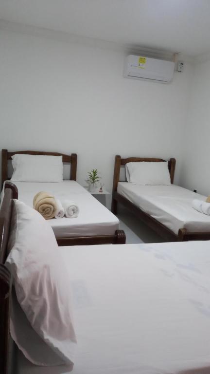 Letto o letti in una camera di Guajira Sunset Hostal