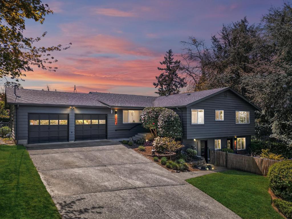 a black house with a driveway at Zen Haus Serene Retreat, prime location with views in Eugene