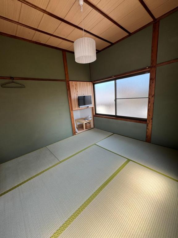 Postel nebo postele na pokoji v ubytování 敷島旅館