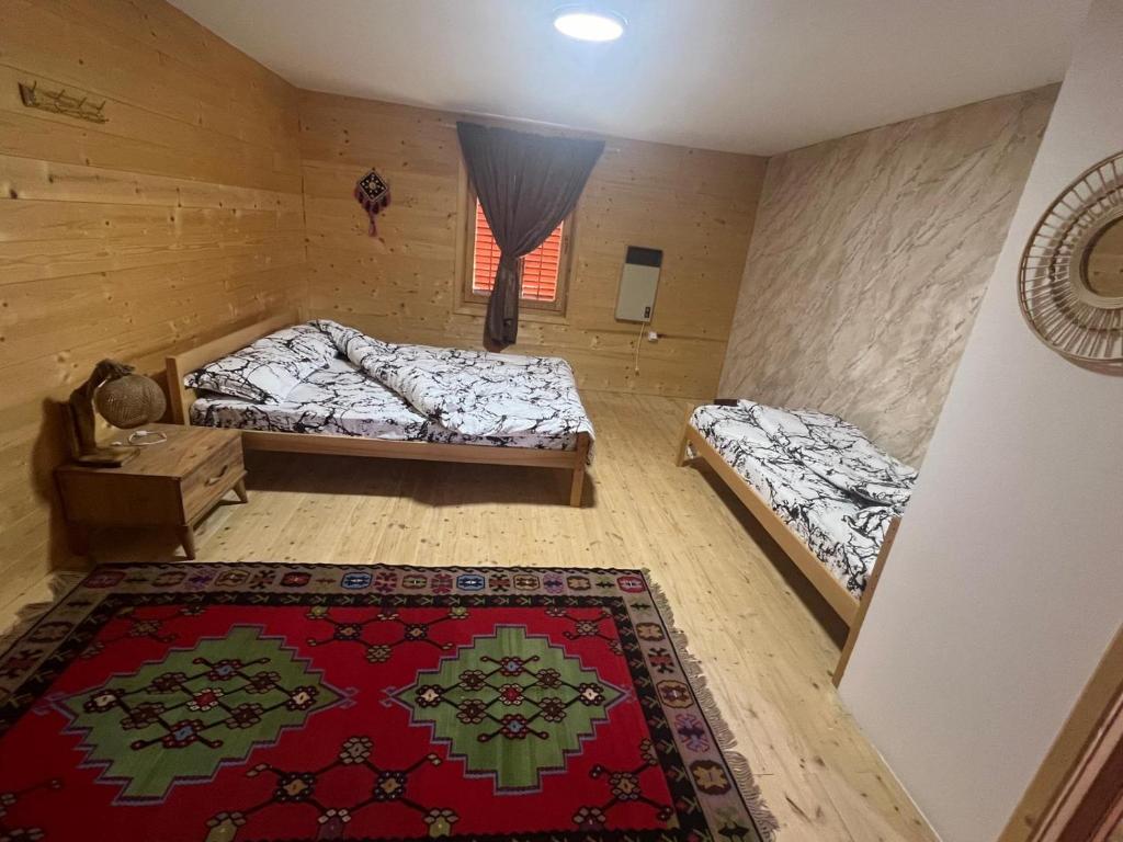 Postel nebo postele na pokoji v ubytování Etno meandri Uvca