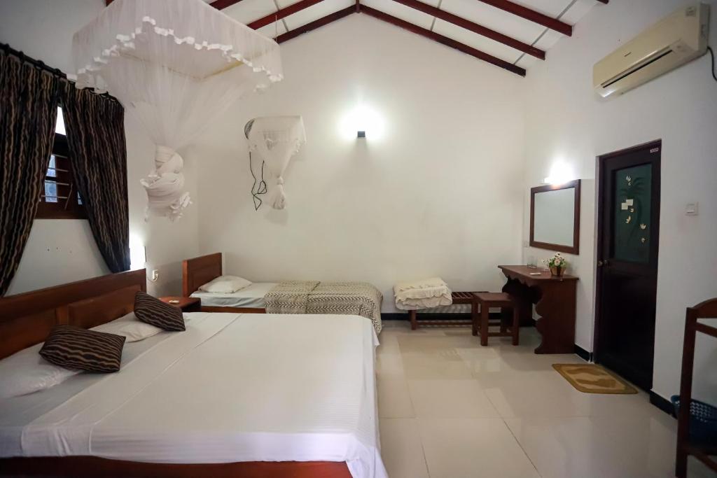 Postel nebo postele na pokoji v ubytování Scenic Cottage Sigiriya