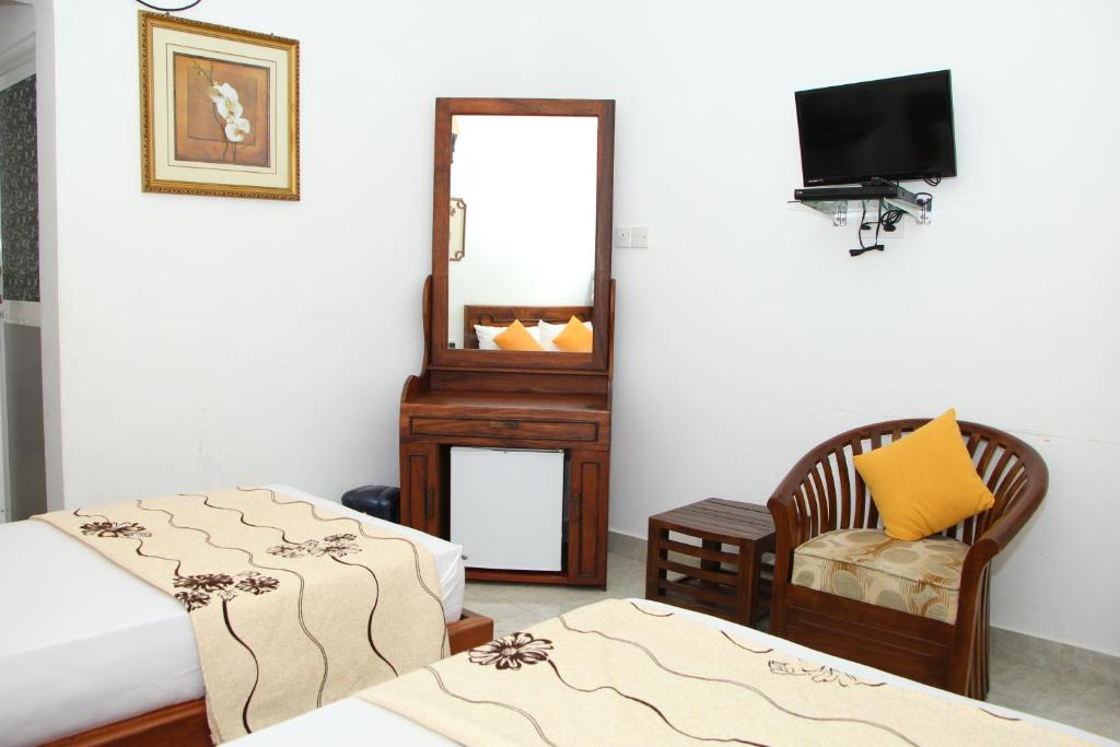 Postel nebo postele na pokoji v ubytování JKAB Park Hotel