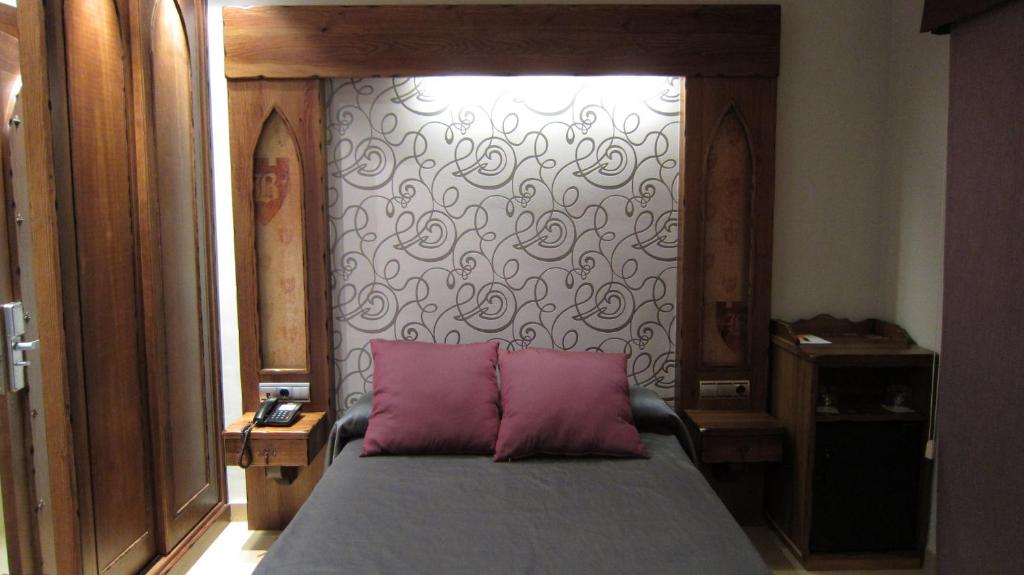 Postel nebo postele na pokoji v ubytování Hotel La Brasa