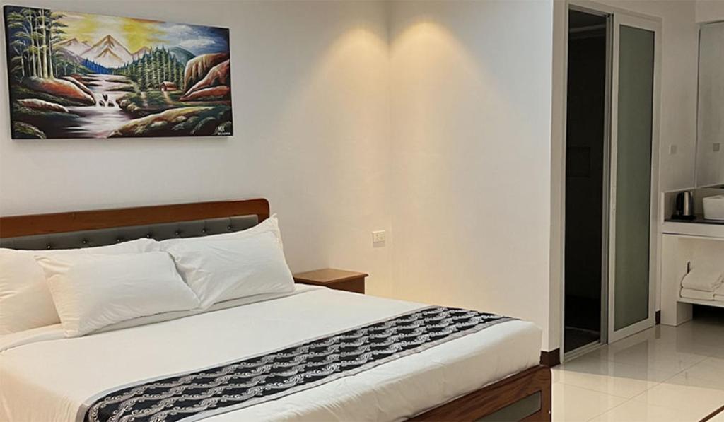 Postel nebo postele na pokoji v ubytování The XIMO Suites