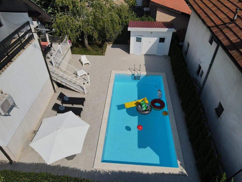 an overhead view of a swimming pool in a backyard at Villa Mina Kladovo, entire charming house with 5 bedrooms in Kladovo