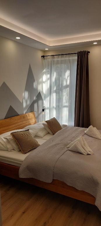 Postel nebo postele na pokoji v ubytování Apartmán SKI Plešivec