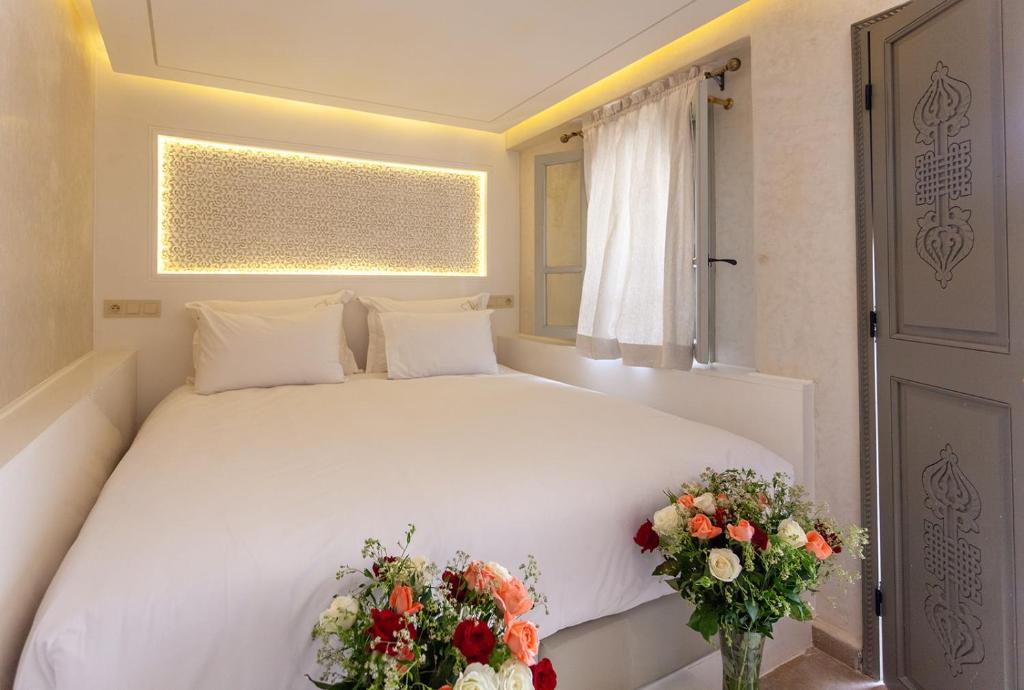 Postel nebo postele na pokoji v ubytování Luxe Nomade Marrakech & Spa
