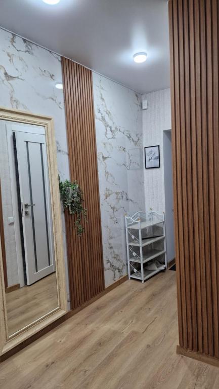 an empty room with a door and a mirror at Centrala in Bălţi