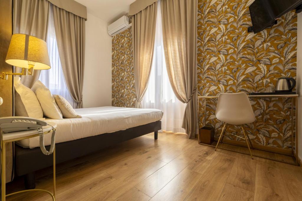 Postel nebo postele na pokoji v ubytování Hotel Bagliori
