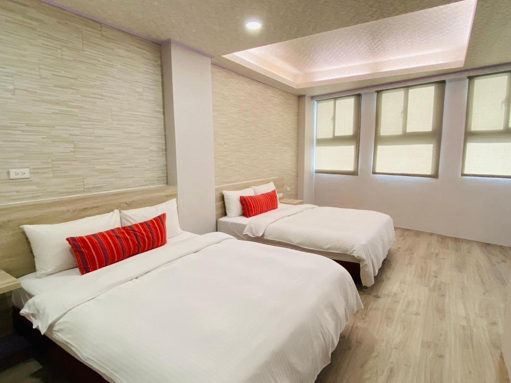 Postel nebo postele na pokoji v ubytování Beauty Garden Hotel - Jiaoxi