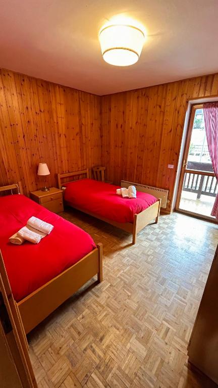 Postel nebo postele na pokoji v ubytování Appartamento Lagorai 1
