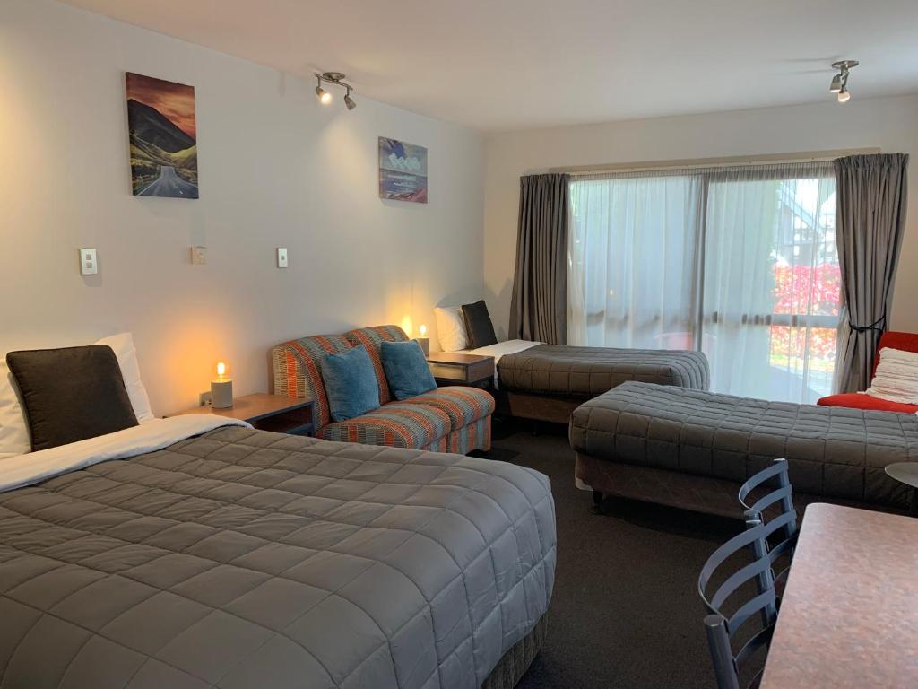 Postel nebo postele na pokoji v ubytování Wakatipu View Apartments