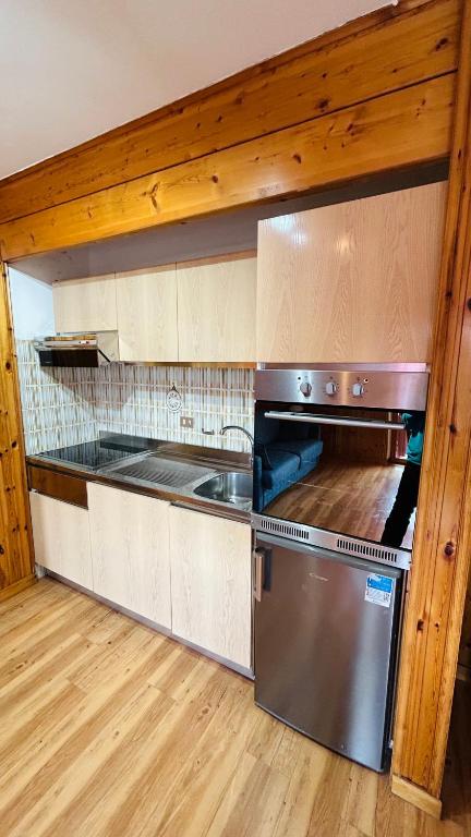 Kuchyň nebo kuchyňský kout v ubytování Appartamento Lagorai 1