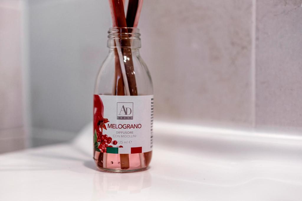a bottle of wine with a stick in it at Acquaterra in Polignano a Mare