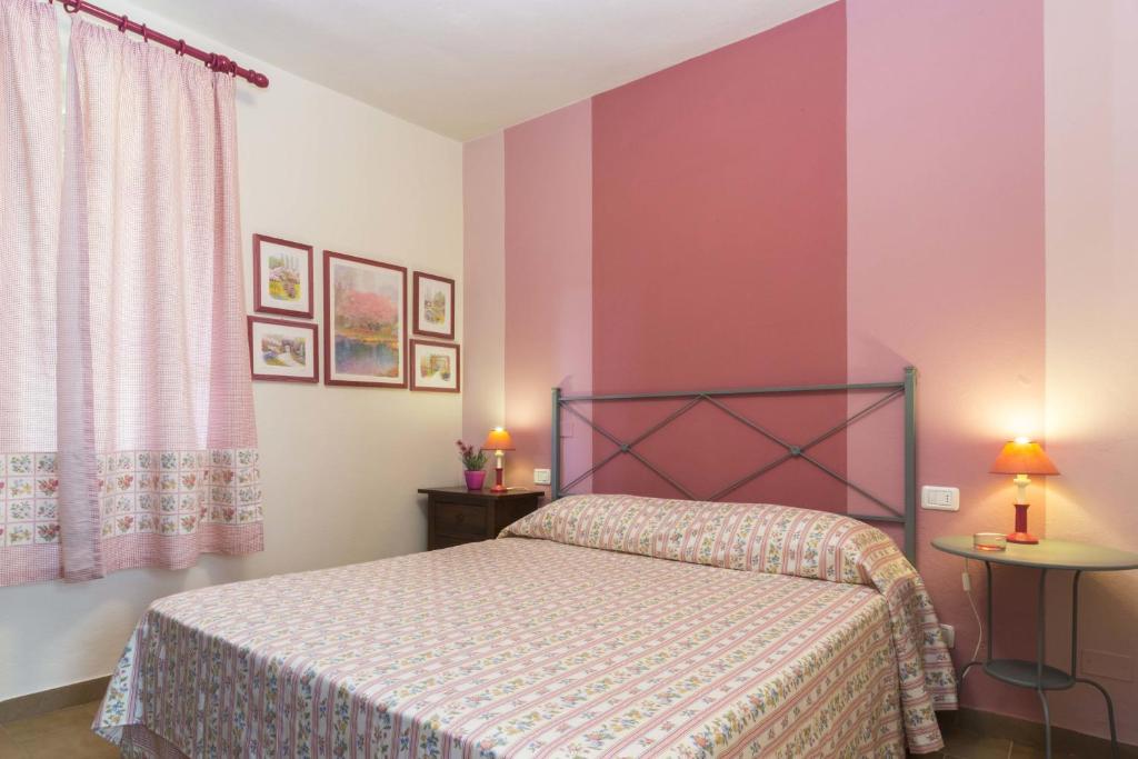Postel nebo postele na pokoji v ubytování Villa Monserrato - Goelba