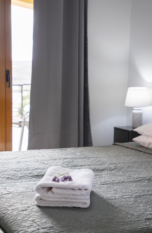 Postel nebo postele na pokoji v ubytování Anesis Apartments