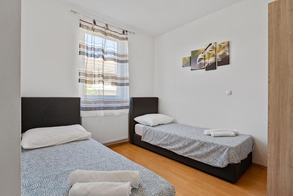 Posteľ alebo postele v izbe v ubytovaní Modern apartment with private pool near Split