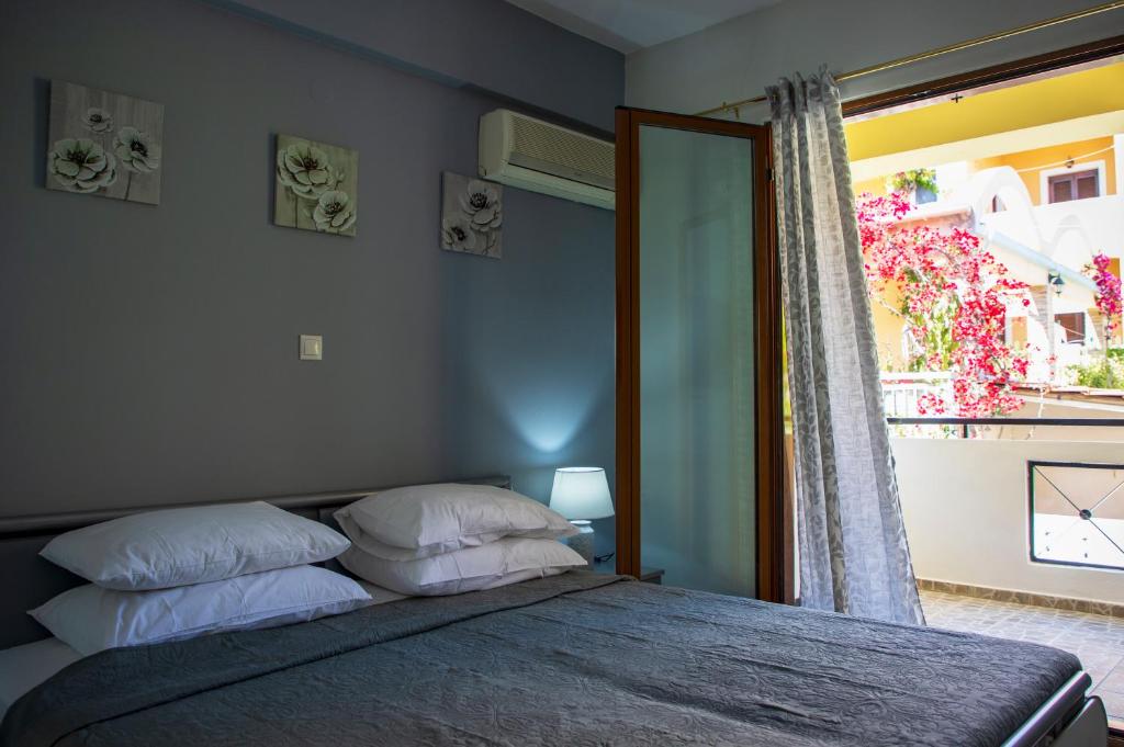 Postel nebo postele na pokoji v ubytování Anesis Apartments