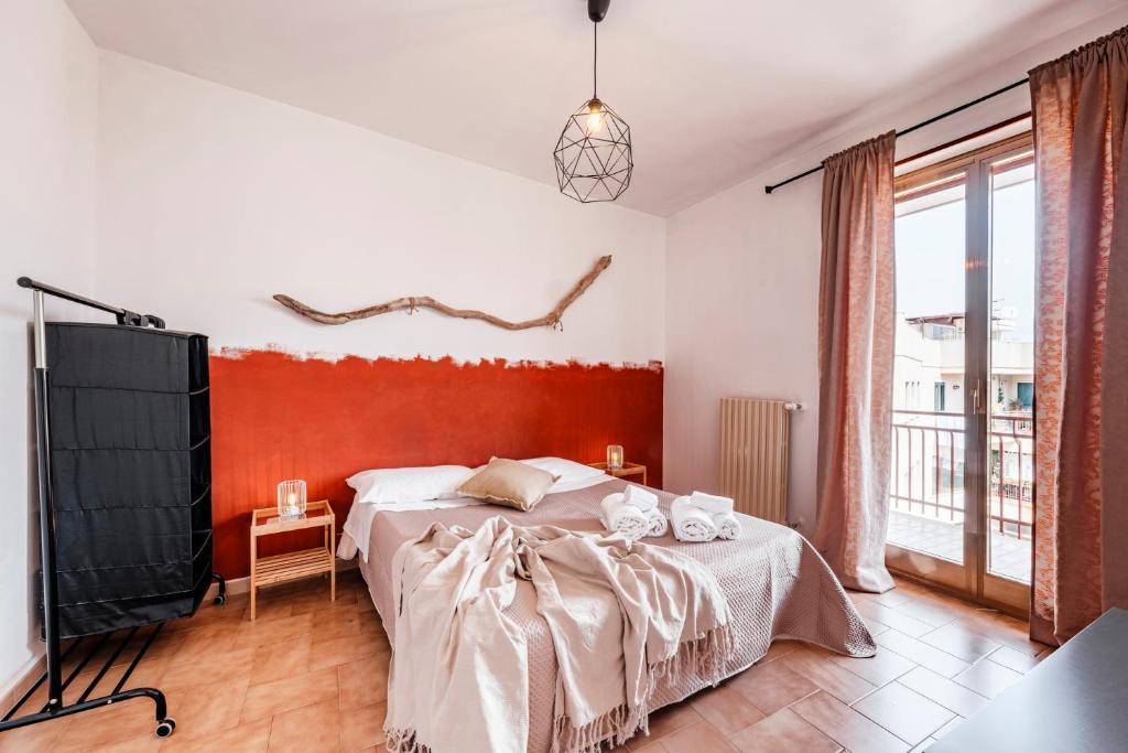 a bedroom with a large bed and a tv at Acquaterra in Polignano a Mare