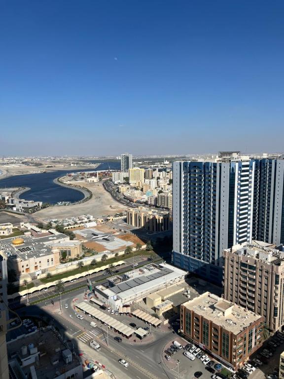 una vista aerea di una città con edifici alti di fantastic city & Seaview Master bedroom in 3bedroom apartment ad Ajman