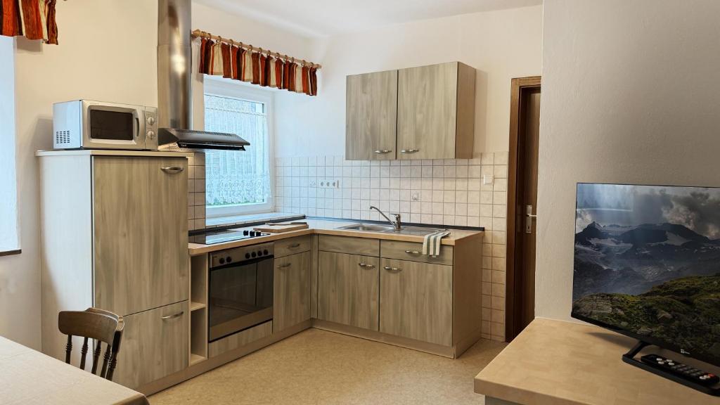 Kuchyň nebo kuchyňský kout v ubytování Residence Barbara