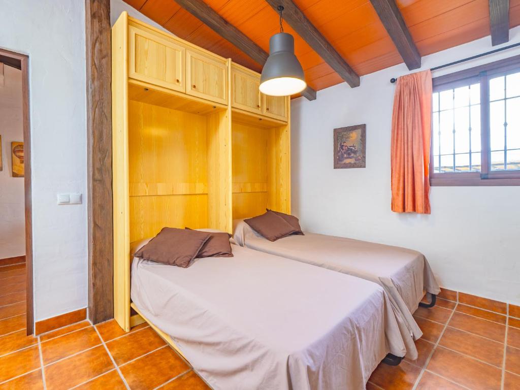 Postel nebo postele na pokoji v ubytování Cubo's Casita Rural Haro