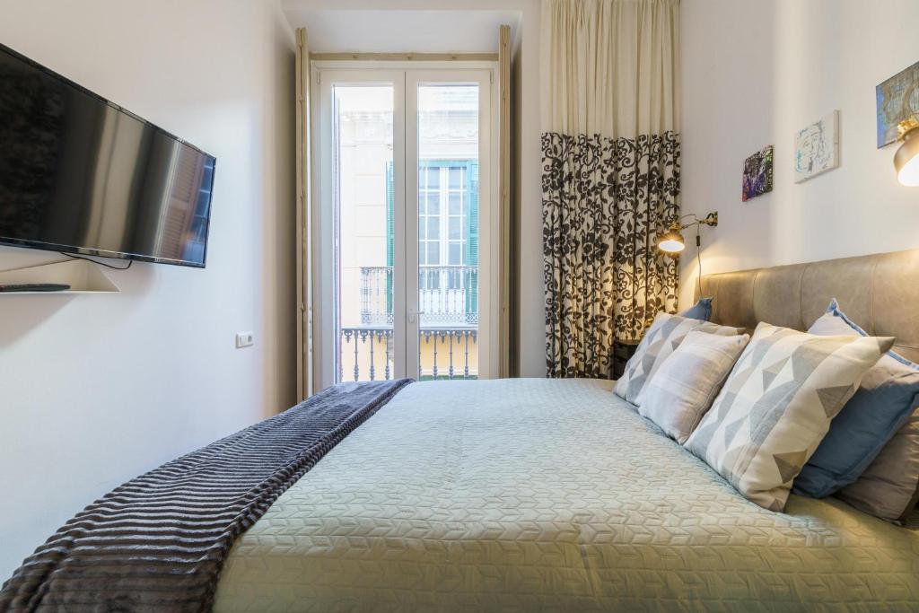 Posteľ alebo postele v izbe v ubytovaní Málaga Center Old Town - Happy Rentals
