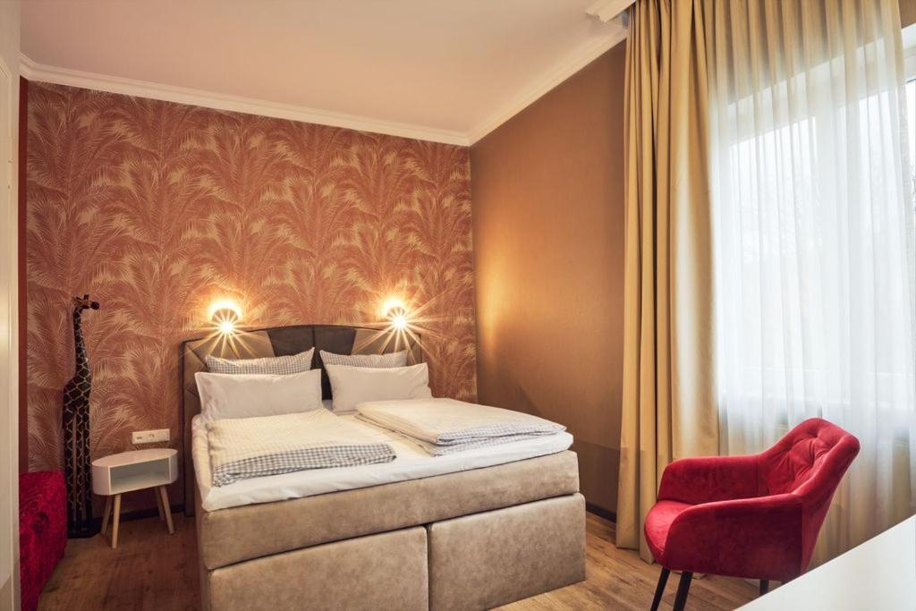 Postel nebo postele na pokoji v ubytování Hotel Starnberger See