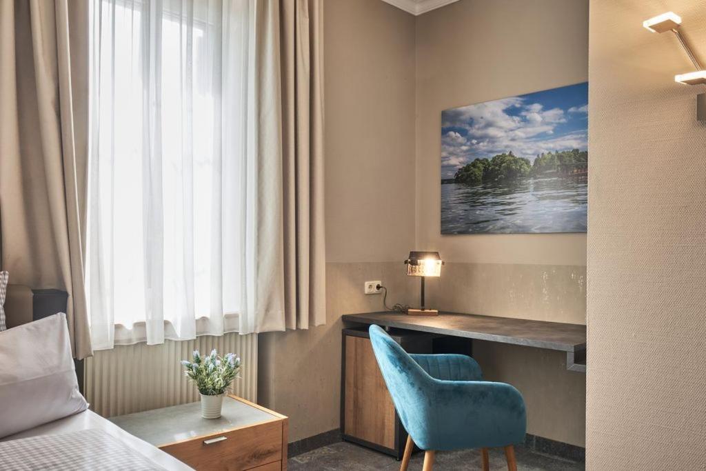 Postel nebo postele na pokoji v ubytování Hotel Starnberger See