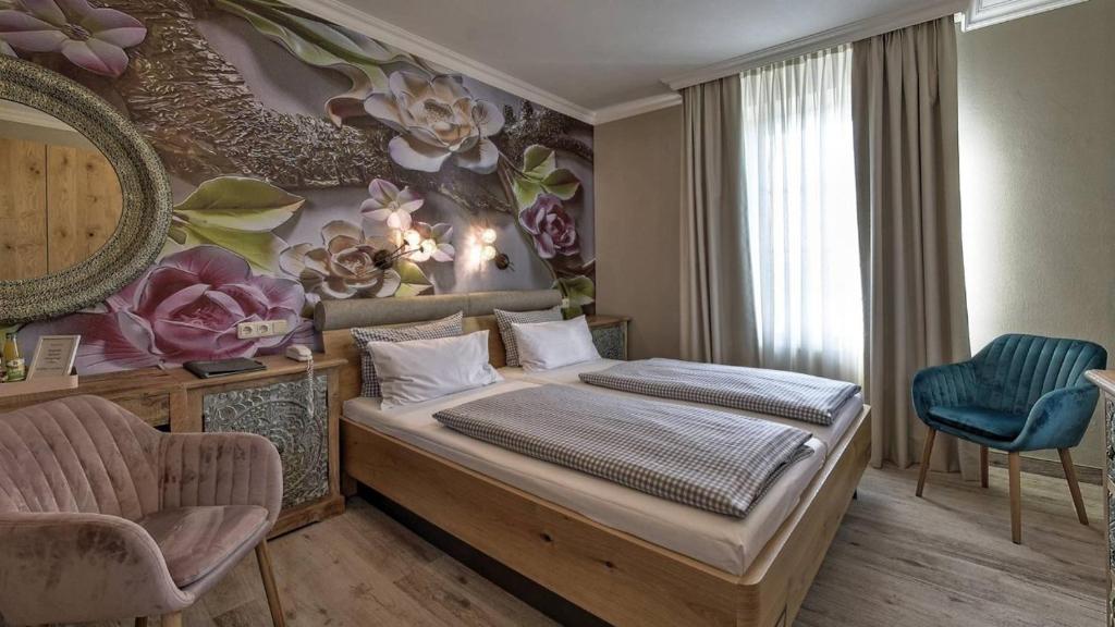 Postel nebo postele na pokoji v ubytování Hotel Starnberger See