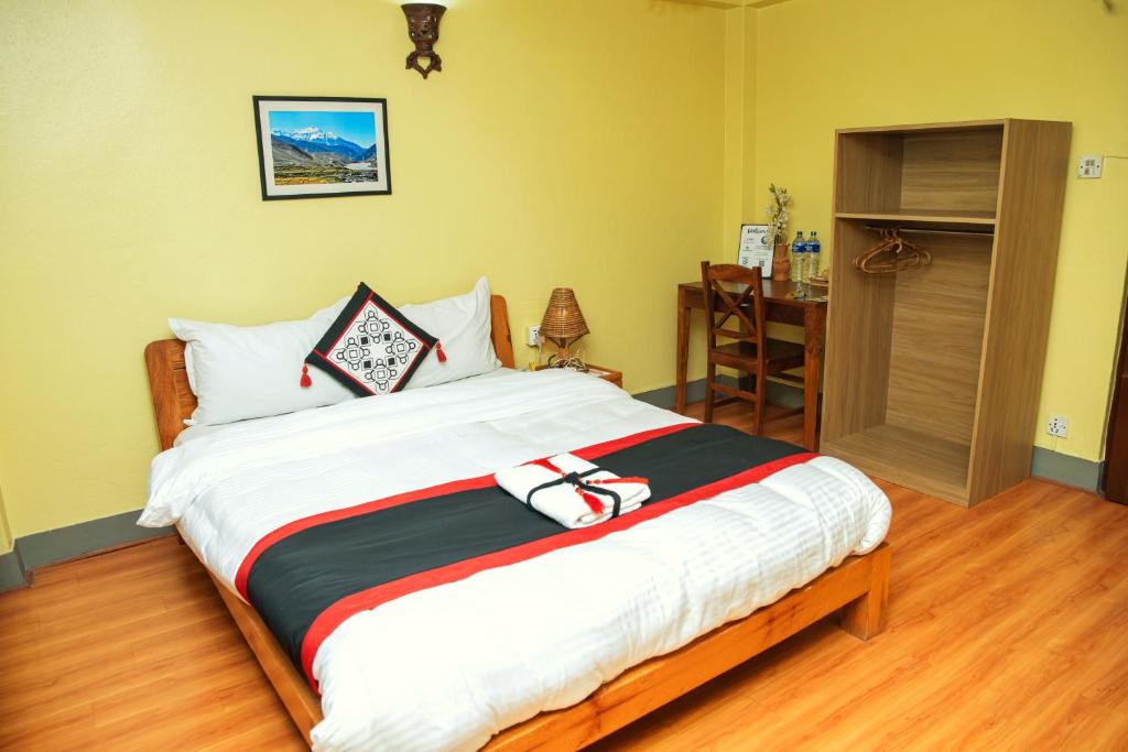 A bed or beds in a room at Peace and Joy Guest House