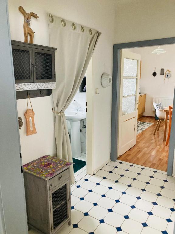 a room with a door leading into a room with a bathroom at Das Ferienhaus-zurück zum Ursprung in Güssing