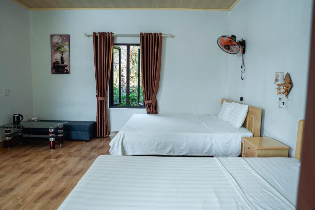 Postel nebo postele na pokoji v ubytování Tran Chau Garden Home