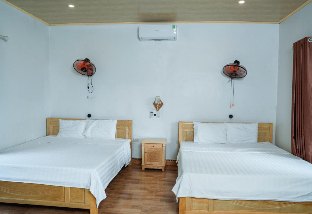 Postel nebo postele na pokoji v ubytování Tran Chau Garden Home