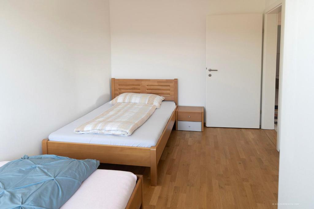 Postel nebo postele na pokoji v ubytování Panoramablick Dobl