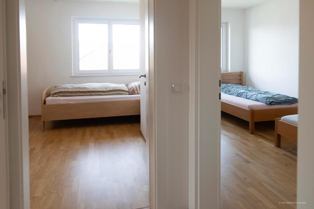 Postel nebo postele na pokoji v ubytování Panoramablick Dobl