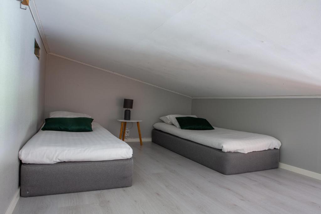 Postel nebo postele na pokoji v ubytování Breviken Golf & Hotell