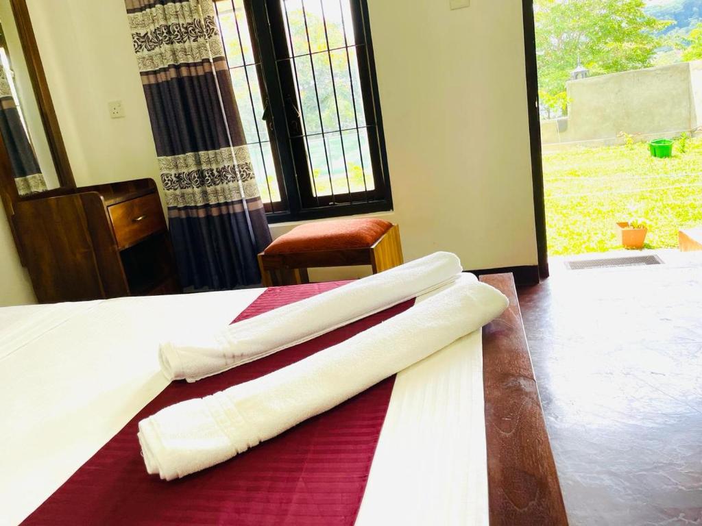 Postel nebo postele na pokoji v ubytování Lake Classical Guest House