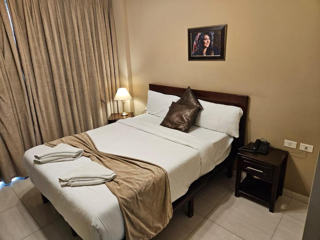 Postel nebo postele na pokoji v ubytování Saint John Hotel