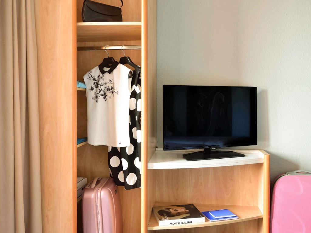 TV a/nebo společenská místnost v ubytování Ibis Budapest Citysouth